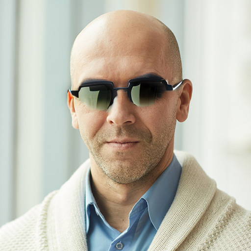 Portrait of bald businessman wearing mirrored sunglasses pouting mouth  stock photo